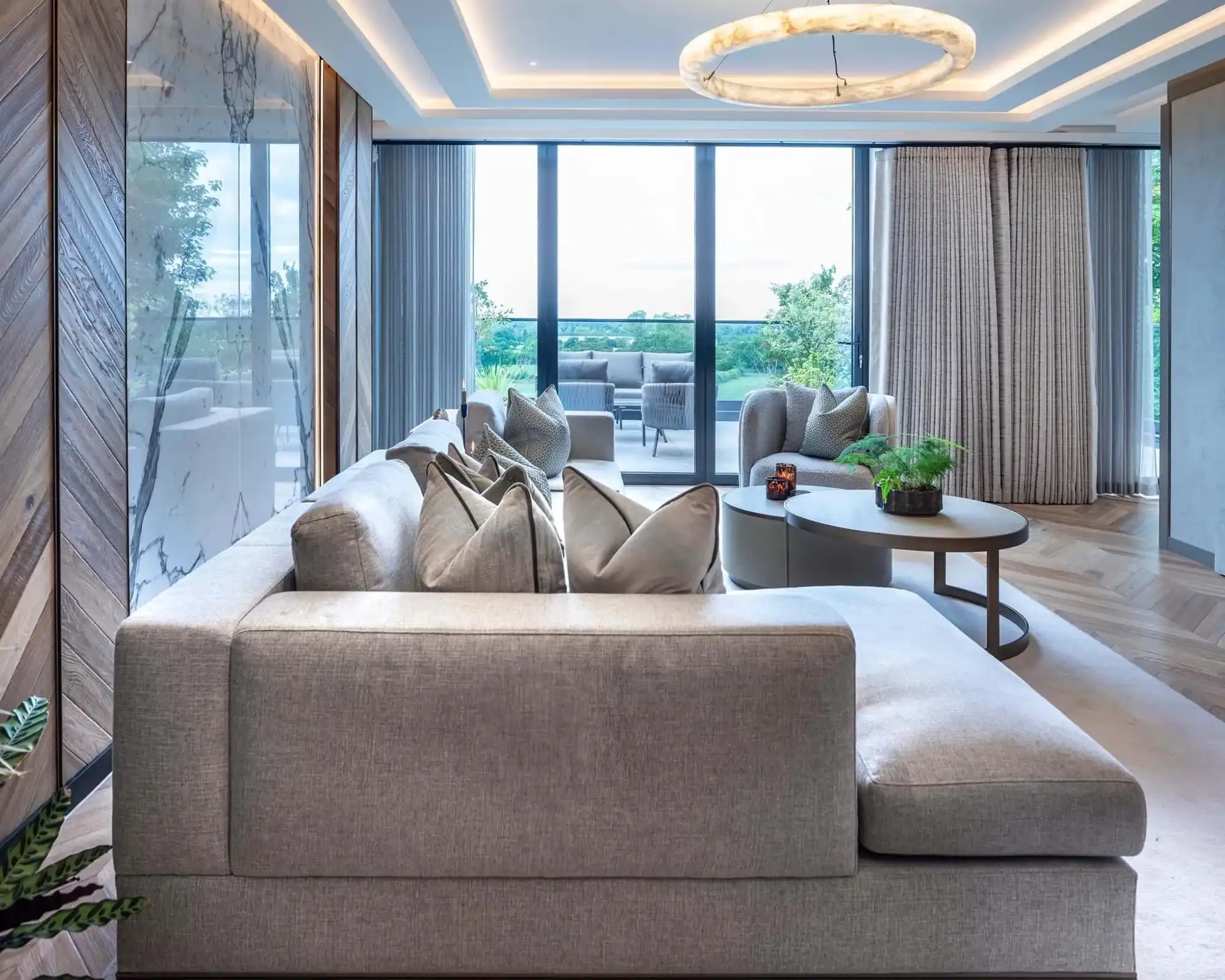 lounge with grey sofa and large window